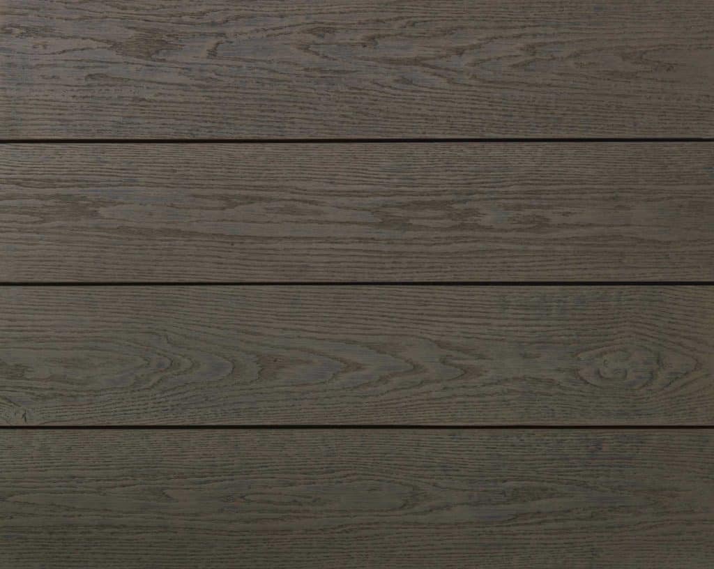 Ebony grey composite decking planks with wood grain texture.