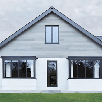House cladding in light grey timber panels.