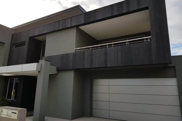 An outdoor view of modern house unleashing the creativity of Envello Cladding.