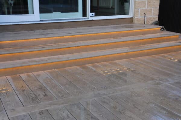 Composite decking Melbourne in illuminated underglow stairs.