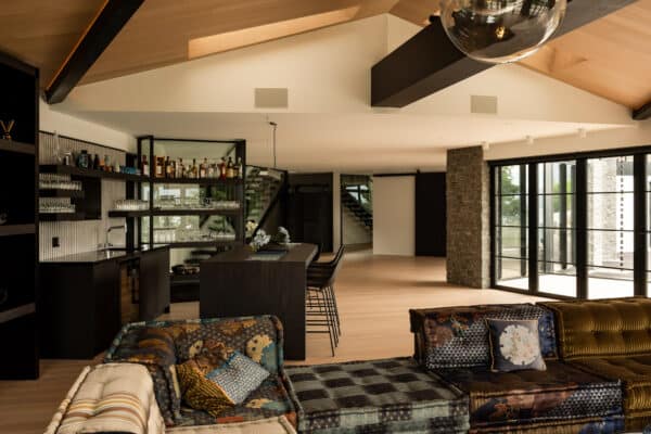 Open-plan living space with bar, millboard composite decking in melbourne, and modern furnishings.