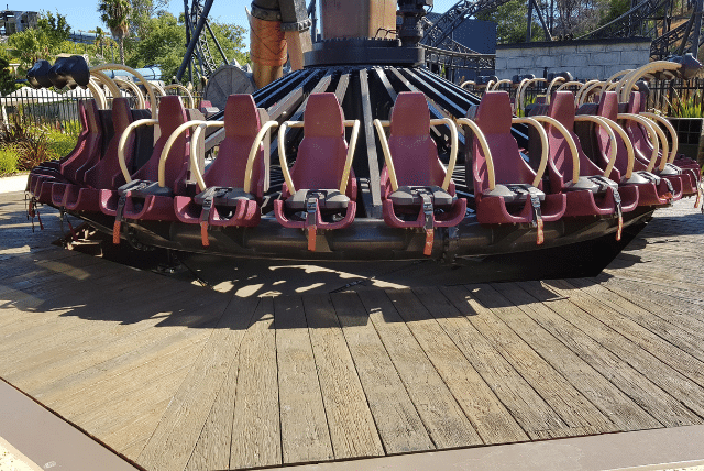 Timeless Outdoor Design: How Composite Decking Designs Elevate Form and Function 1 Concept Materials Composite Decking Empty seats on a steampunk-themed amusement park ride, showcasing composite decking designs.