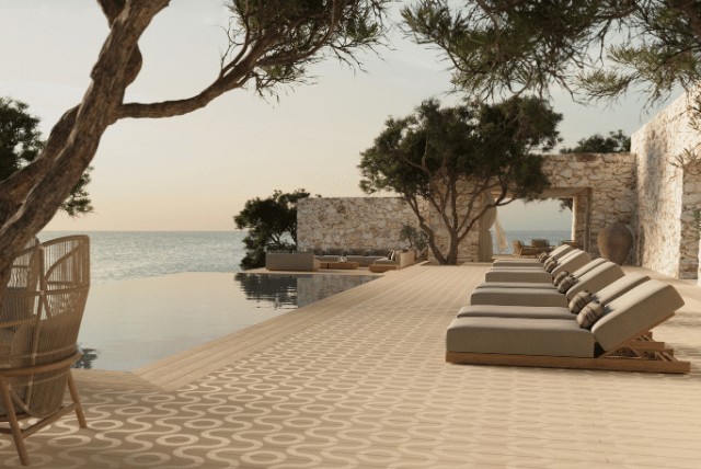 Outdoor lounge area with Millboard weather resistant decking by the ocean.
